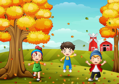 快乐的孩子们玩着秋天的落叶